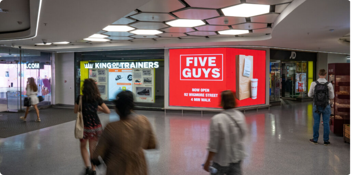 Place-based Mad Five Guys DOOH signage