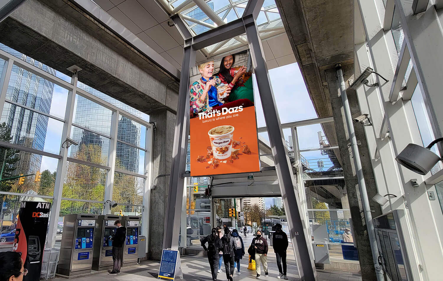 SkyTrain station with a billboard